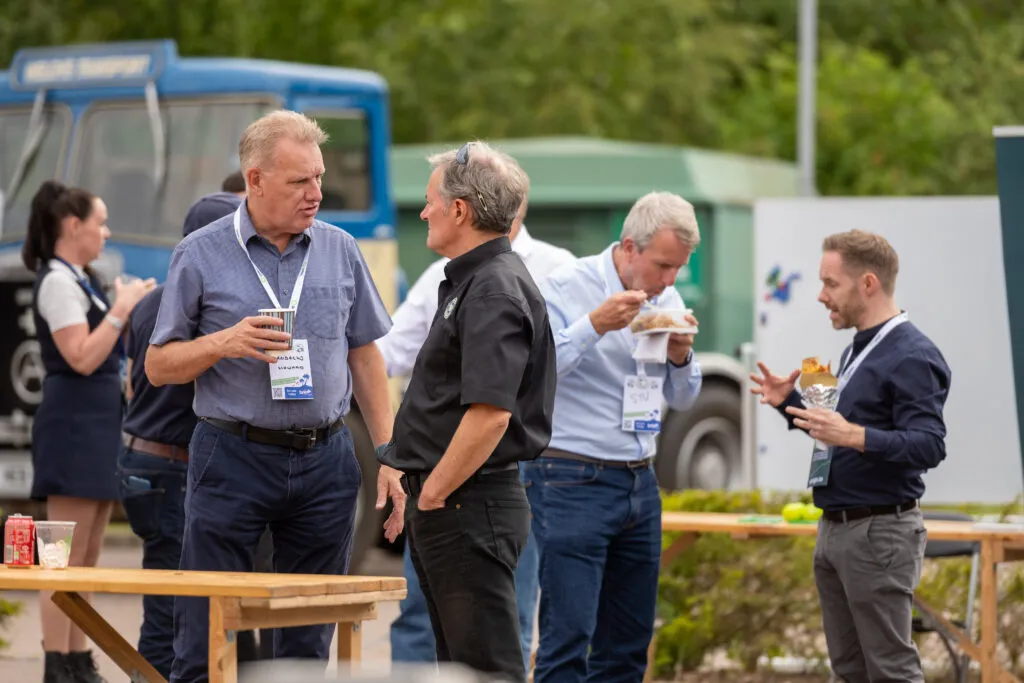 People collaborating at a freight industry event
